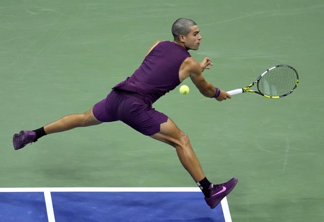Tennis - U.S. Open - Flushing Meadows, New York, United States - August 25, 2025 Spain's Carlos Alcaraz in action during his first round match against Reilly Opelka of the U.S. REUTERS/Eduardo Munoz