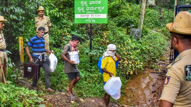 Dakshina Kannada: Workers leave from a site of an alleged burial related to the Dharmasthala mass burial case, at Dharmasthala, in Dakshina Kannada district,