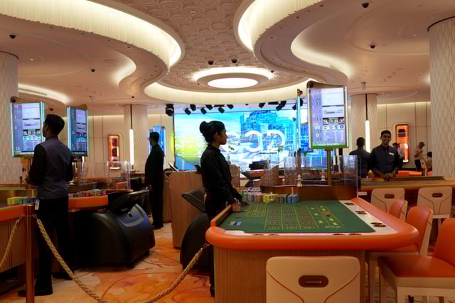 Employees stand inside a casino at City of Dreams, an integrated resort that includes Sri Lanka's first high end casino, in Colombo, Sri Lanka, August 25, 2025. REUTERS/Thilina Kaluthotage