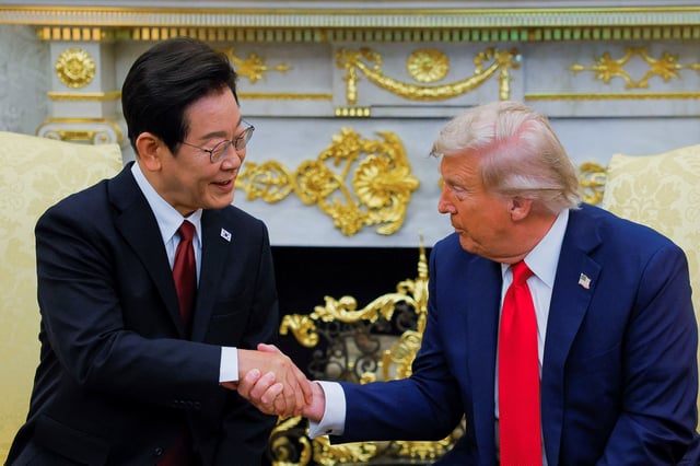 U.S. President Donald Trump shakes hands with South Korean President Lee Jae Myung in the Oval Office at the White House in Washington, D.C., U.S., August 25, 2025. REUTERS/Brian Snyder