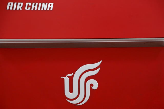 Air China's logo is seen on a counter of Air China at a terminal of Beijing Capital International Airport in Beijing, China, March 28, 2016.REUTERS/Kim Kyung-Hoon/File Photo