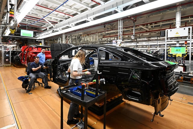People work at the Volkswagen (VW) electric fleet lead plant in Emden, Germany, February 18, 2025. REUTERS/Carmen Jaspersen/ File Photo