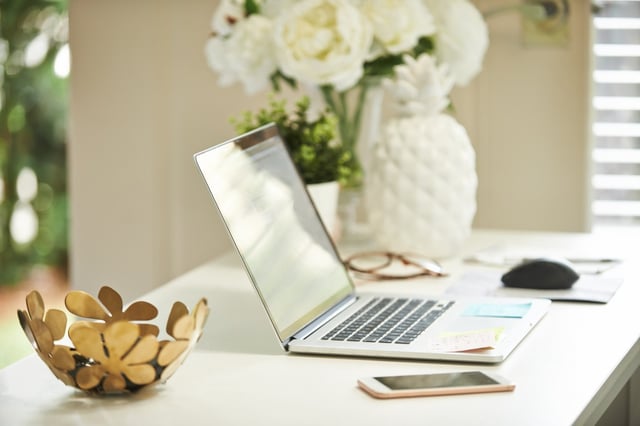Whether you have a home office or a small desk near the kitchen for your things, you spend the majority of the day in your workspace. And if it's piled high with papers, cereal bowls and old sticky notes, it can get tiring to look at. The less you enjoy your workspace, the more reasons you'll find to be away from it both physically and mentally. Similar to decluttering the messy parts of your home, toss out things you don't need and add some pleasing touches like a houseplant or a calming candle.