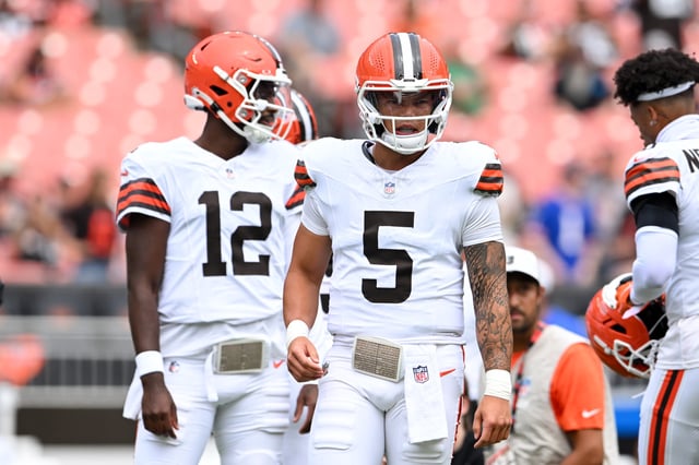 Dillon Gabriel #5 and Shedeur Sanders #12 of the Cleveland Browns look on prior to an NFL Preseason 2025 game against the Los Angeles Rams at Huntington Bank Field on August 23, 2025 in Cleveland, Ohio.