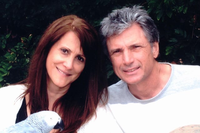 "American Idol" supervisor Robin Kaye and her husband, Thomas Deluca, are seen posing for a photo together.