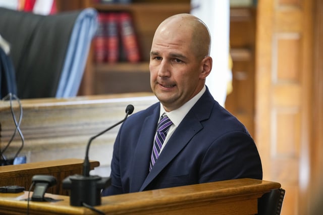 Dedham, MA – June 10: Massachusetts State Police Trooper Michael Proctor takes the stand during Karen Read’s murder trial at Norfolk Superior Court.
