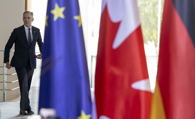 Prime Minister Mark Carney arrives for a joint media availability with German Chancellor Friedrich Merz (not shown) at the Federal Chancellery in Berlin, Germany on Tuesday, Aug. 26, 2025. THE CANADIAN PRESS/Christinne Muschi