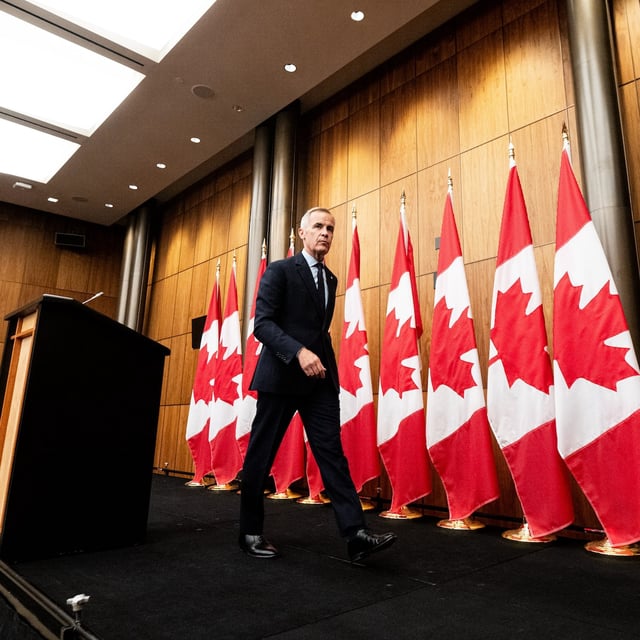 Prime Minister Mark Carney departs a press conference at the National Press Theatre in Ottawa, on Aug. 22.