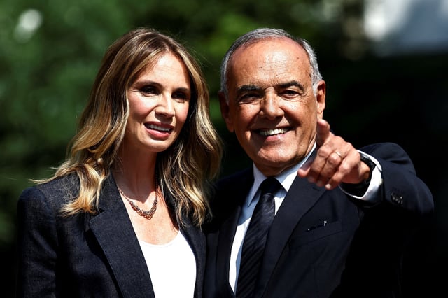 Alberto Barbera, Director of the 82nd Venice Film Festival, poses with host Emanuela Fanelli, a day before the start of the 82nd Venice Film Festival, in Venice, Italy, August 26, 2025. REUTERS/Yara Nardi     TPX IMAGES OF THE DAY
