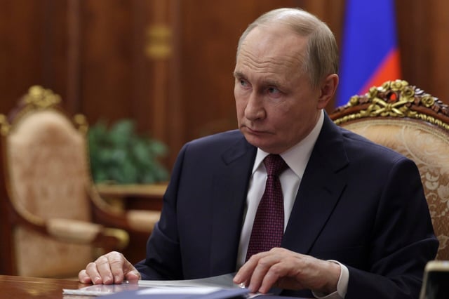 Russian President Vladimir Putin meets with Deputy Prime Minister, Chief of the Government Staff Dmitry Grigorenko at the Kremlin in Moscow, Russia, Monday, Aug. 25, 2025. (Vyacheslav Prokofyev, Sputnik, Kremlin Pool Photo via AP)