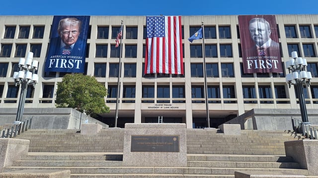 The Department of Labor building, displaying a banner of Donald Trump and Theodore Roosevelt.