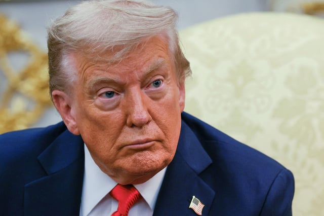 U.S. President Donald Trump attends a meeting with South Korean President Lee Jae Myung (not pictured) at the Oval Office, at the White House, in Washington, D.C., U.S., August 25, 2025. REUTERS/Brian Snyder/File Photo