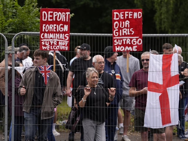 Protesters outside the former Bell Hotel in Epping, believed to be housing asylum seekers, where there have been a number of demonstrations, after police charged 38-year-old asylum seeker Hadush Gerberslasie Kebatu with sexual assault following an incident where he is alleged to have attempted to kiss a 14-year-old girl. Picture date: Sunday July 27, 2025. (Photo by Jordan Pettitt/PA Images via Getty Images)