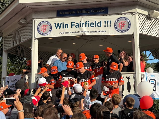 The Fairfield National Little League team was hounded for autographs as it celebrated its run in the Little League World Series with a parade on Monday. (Joe Arruda/Hartford Courant)