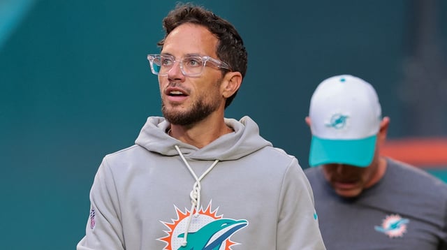 Aug 23, 2025; Miami Gardens, Florida, USA; Miami Dolphins head coach Mike McDaniel enters the field before the game against the Jacksonville Jaguars at Hard Rock Stadium. Mandatory Credit: Sam Navarro-Imagn Images