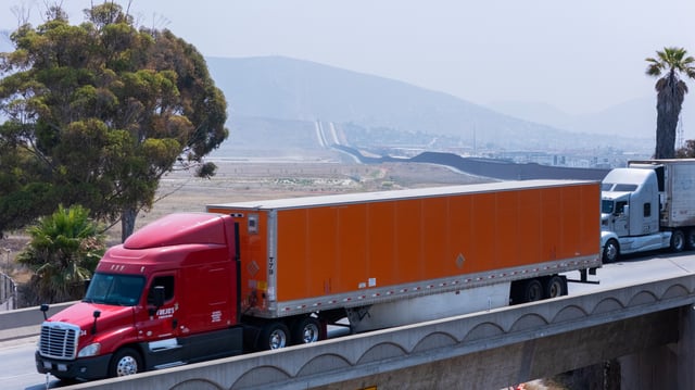 A drone view shows semi-trucks in San Diego, California, U.S., July 15, 2025.  REUTERS/Mike Blake/File Photo