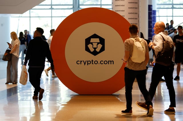 The logo of Crypto.com is seen at a stand during the Bitcoin Conference 2022 in Miami Beach, Florida, U.S. April 6, 2022. REUTERS/Marco Bello/File Photo