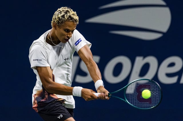 Aug 25, 2025; Flushing, NY, USA; Gabriel Diallo of Canada in action against Damir Dzumhur of Bosnia and Herzegovina in the first round of the men’s singles at the US Open at Billie Jean King National Tennis Centre. Mandatory Credit: Mike Frey-Imagn Images