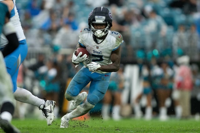 Dec 29, 2024; Jacksonville, Florida, USA; Tennessee Titans running back Tyjae Spears (2) runs the ball against the Jacksonville Jaguars in the second quarter at EverBank Stadium. Mandatory Credit: Jeremy Reper-Imagn Images/File Photo