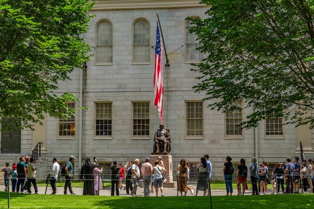 View of statue of John Harvard on the campus of this private Ivy League research university, Cambridge, MA, July 15, 2025. Image for illustration purposes only.