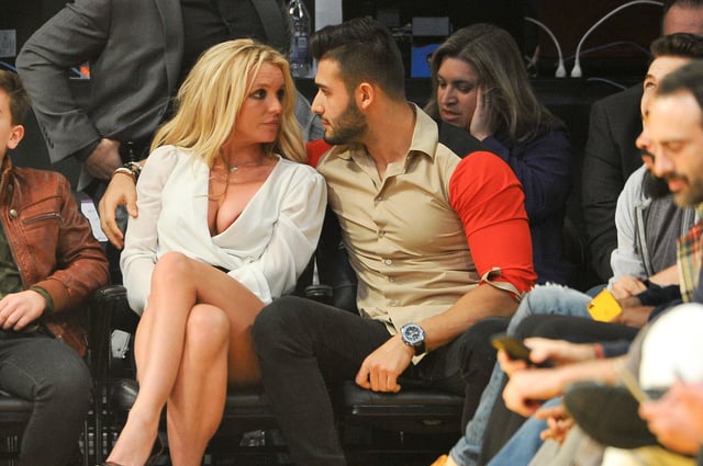 Britney Spears and Sam Asghari attend a basketball game between the Los Angeles Lakers and the Golden State Warriors