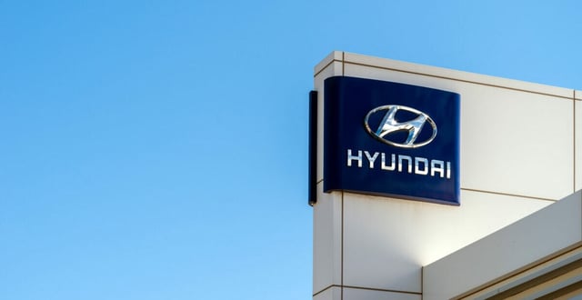 Adelaide, Australia - September 8, 2018: Photo of Hyundai Automotive logo on official dealer building against clean blue sky on a bright day
