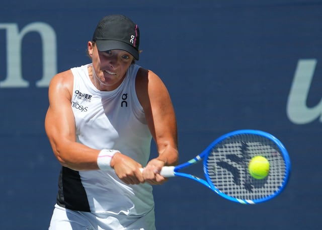 Aug 26, 2025; Flushing, NY, USA;  Iga Swiatek (POL) hits to Emiliana Arango (COL) (not pictured) on day three of the 2025 U.S. Open tennis tournament at the USTA Billie Jean King National Tennis Center. Mandatory Credit: Robert Deutsch-Imagn Images