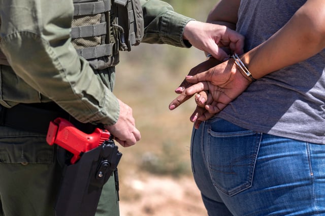 A U.S. Border Patrol trainee conducts a mock detention scenario at the U.S. Border Patrol Academy on August 22, 2025 in Artesia, New Mexico.