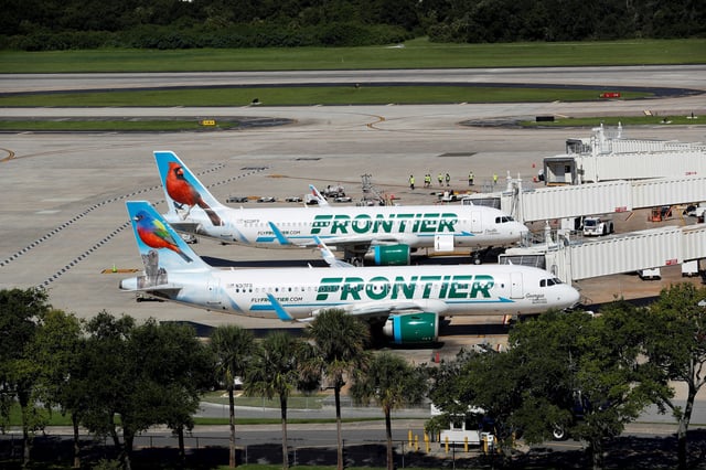 Frontier Airlines planes are parked at the boarding gates at Tampa International Airport in Tampa, Florida, U.S., July 19, 2024. REUTERS/Octavio Jones/File Photo