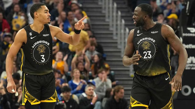 Warriors guard Jordan Poole (3) and forward Draymond Green (23) celebrate during the second quarter against the Utah Jazz at Chase Center