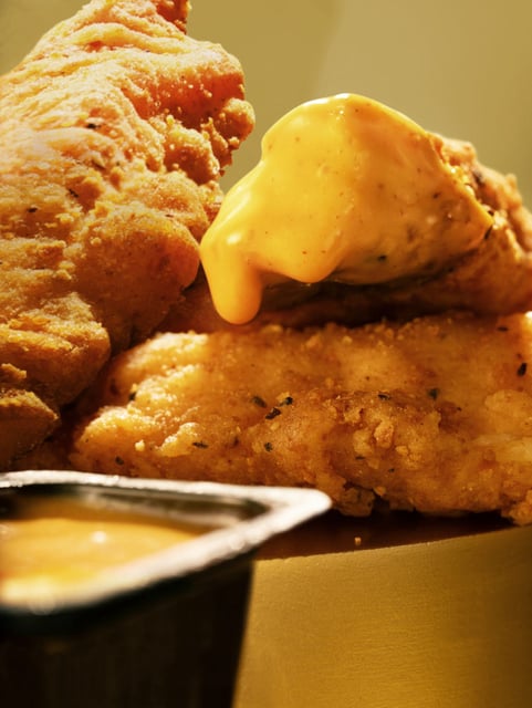 McDonald's Special Edition Gold Sauce on McCrispy Strips. The sauce is a blend of vinegary North Carolina BBQ sauce with notes of honey, smoke and mustard. The sauce is available nationwide on Sept. 3, 2025.
