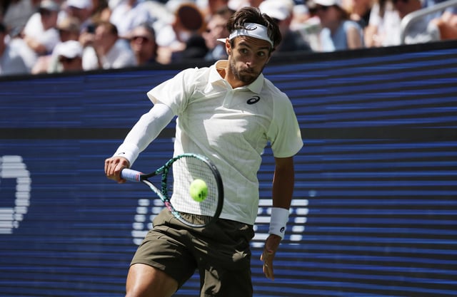 Tennis - U.S. Open - Flushing Meadows, New York, United States - August 26, 2025 Italy's Lorenzo Musetti in action during his first round match against France's Giovanni Mpetshi Perricard REUTERS/Jeenah Moon