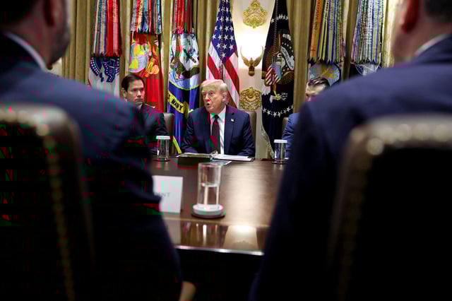 U.S. President Donald Trump speaks, flanked by Secretary of State Marco Rubio and Defense Secretary Pete Hegseth during a cabinet meeting at the White House in Washington, D.C., U.S., August 26, 2025. REUTERS/Jonathan Ernst