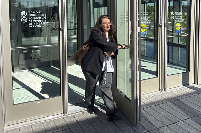 FILE - Heather Honey, a conservative election researcher, leaves the federal courthouse in Harrisburg, Pa., Oct. 18, 2024. (AP Photo/Mark Scolforo, File)
