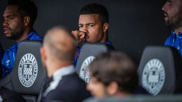Igamane stares at Rangers assistant manager Matt Gill and head coach Russell Martin after his refusal to come off the bench on Sunday