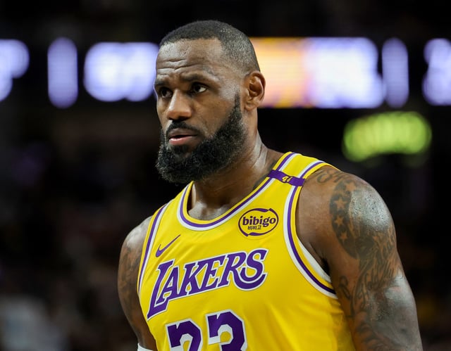 LeBron James #23 of the Los Angeles Lakers walks on the court during a break in the third quarter of a preseason game against the Golden State Warriors at T-Mobile Arena at T-Mobile Arena on October 15, 2024 in Las Vegas, Nevada.