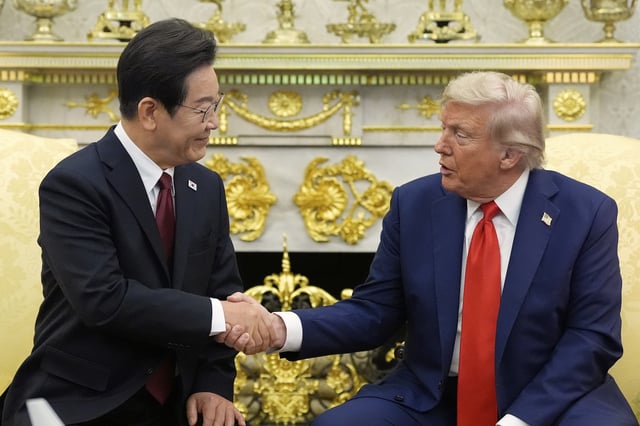 President Donald Trump, right, shakes the hand of South Korean President Lee Jae Myung during a meeting in the Oval Office of the White House, Monday, Aug. 25, 2025, in Washington. (AP Photo/Alex Brandon)
