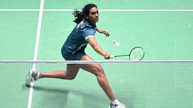 PV Sindhu hits a return to Bulgaria's Kaloyana Nalbantova during their World Championships match on Tuesday. (AFP)
