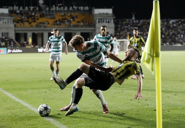 Soccer Football - UEFA Champions League - Play Off - Second Leg - Kairat v Celtic - Ortalyk Stadion, Almaty, Kazakhstan - August 26, 2025 Celtic's Arne Engels in action with Kairat's Ofri Arad REUTERS/Pavel Mikheyev