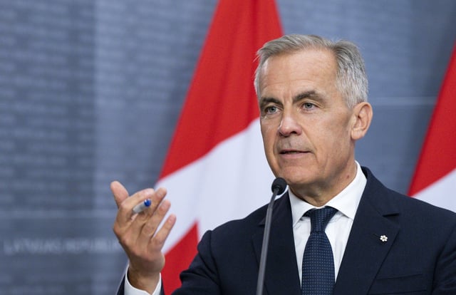 Prime Minister Mark Carney answers questions from the media during a joint press conference with Latvian Prime Minister Evika Silina (not shown) at the Cabinet of Ministers in Riga, Latvia, on Tuesday, Aug. 26, 2025. THE CANADIAN PRESS/Christinne Muschi