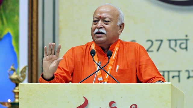 RSS chief Mohan Bhagwat addresses the gathering during an event to mark 100 years of RSS at Bharat Mandapam, in New Delhi on Tuesday.