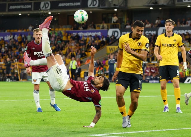 Soccer Football - Carabao Cup - Second Round - Wolverhampton Wanderers v West Ham United - Molineux Stadium, Wolverhampton, Britain - August 26, 2025 West Ham United's Lucas Paqueta in action with Wolverhampton Wanderers' Andre Action Images via Reuters/Andrew Boyers