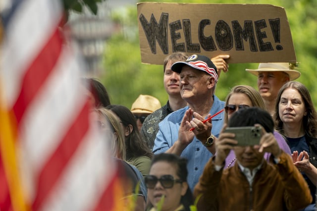 Spectators clap during a naturalization ceremony for new U.S. citizens at Seattle Center on July 4, 2025 in Seattle, Washington.