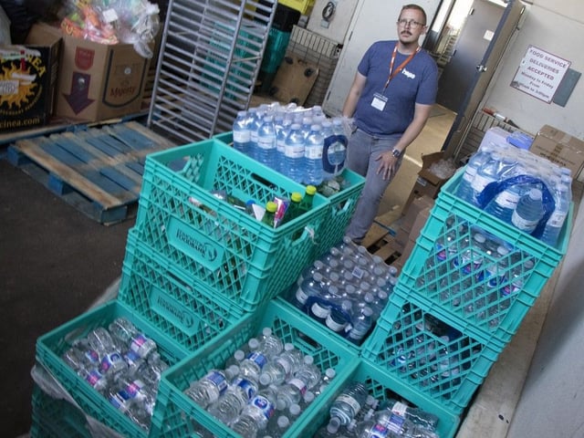 Kevin Wiebe with a pallet of water donated to the Hope Mission for the hot weather response on on Monday, August 25, 2025. Hope Mission is asking the community to help care for the most vulnerable during this excessive heatwave. The needs of those experiencing homelessness are significant during this spike in temperatures. Community members become easily dehydrated, and are also vulnerable to heatstroke and severe sunburn during the hot weather.
