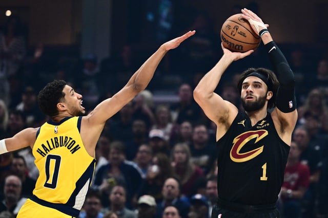Cleveland, Ohio; Cleveland Cavaliers guard Max Strus (1) shoots over the defense of Indiana Pacers guard Tyrese Haliburton (0) during game five of the second round for the 2025 NBA Playoffs: Ken Blaze-Imagn Images