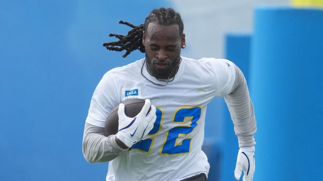 Los Angeles Chargers running back Najee Harris (22) carries the ball during offseason workouts at The Bolt. 