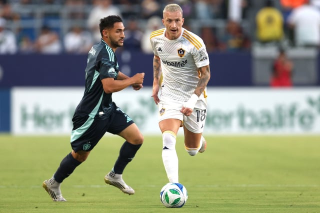 Galaxy midfielder Marco Reus, right, moves the ball against the Seattle Sounders FC during the first half Aug. 10, 2025, at Dignity Health Sports Park. (Photo by Raul Romero Jr., Contributing Photographer)