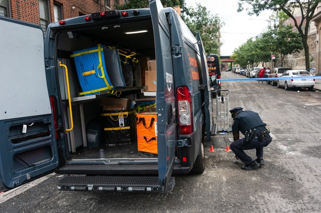 Police investigate after an Amazon driver was shot on Bryant Ave. and East Tremont Ave. in the Bronx, New York City on Tuesday, Aug. 26, 2025. (Gardiner Anderson / New York Daily News)