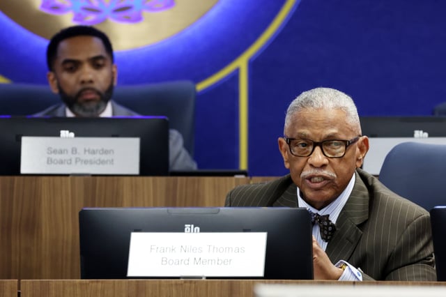 Chicago Board of Education board member Frank Niles Thomas, right, speaks at Chicago Public Schools headquarters, June 11, 2025, after it was announced he is stepping down. Board  President Sean Harden is at left. (Terrence Antonio James/Chicago Tribune)