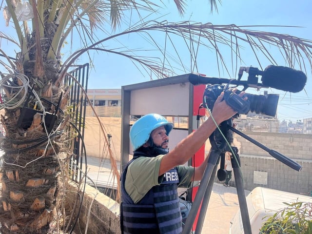 Palestinian cameraman Hussam al-Masri, who was a contractor for Reuters and killed in Israeli strikes on Nasser hospital on August 25, 2025, works at Nasser hospital, in Khan Younis in the southern Gaza Strip August 7, 2024. REUTERS/Stringer